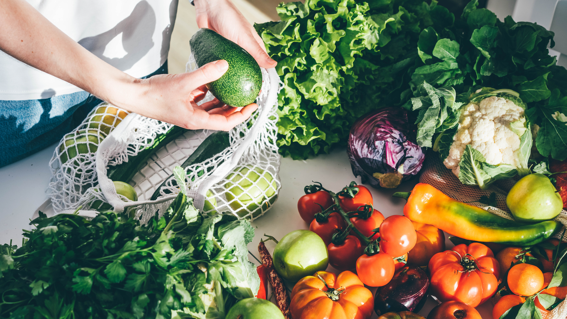 woman unpacking healthy groceries