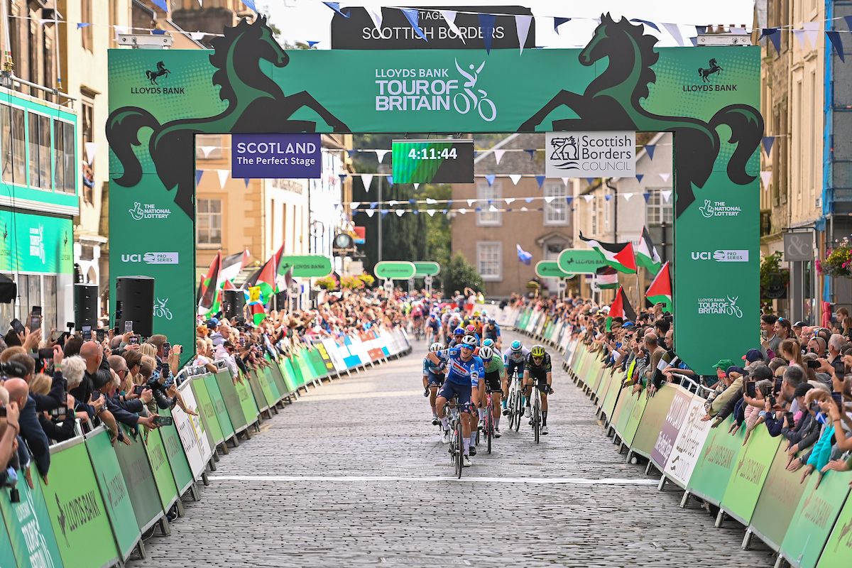 Picture by Will Palmer/SWpix.com - 03/09/2024 - Lloyds Bank Tour of Britain 2024 - Stage 1: The Scottish Borders Stage, Kelso to Kelso, Scotland - Paul Magnier (Soudal Quick-Step) celebrates winning Stage 1 of the Lloyds Bank Tour of Britain 2024 in Kelso