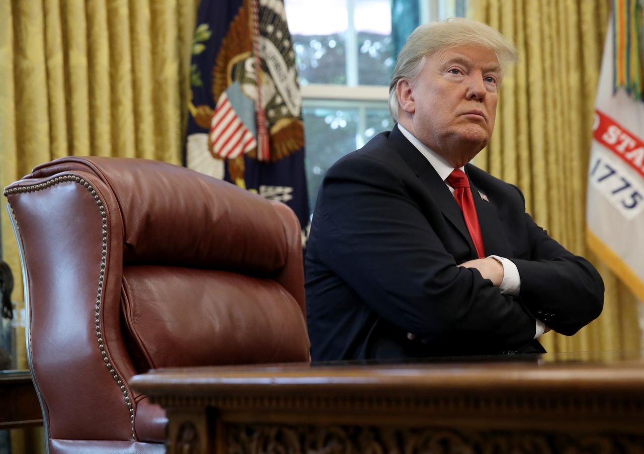 Trump in the Oval Office sitting at his desk