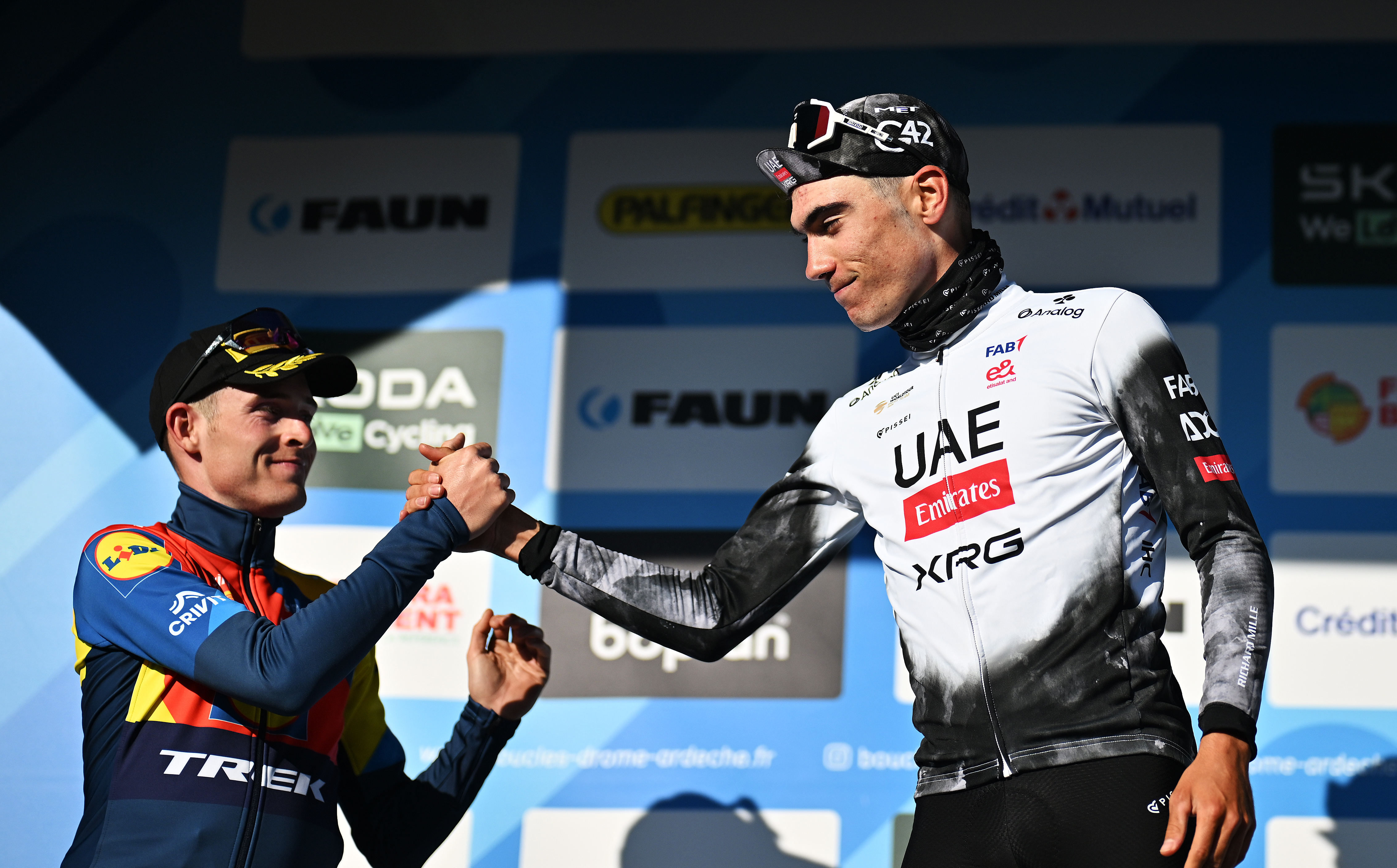 ETOILE-SUR-RHONE, FRANCE - MARCH 02: (L-R) Mattias Skjelmose of Denmark and Team Lidl-Trek on second place and race winner Juan Ayuso of Spain and UAE Team Emiratespose on the podium ceremony after the 13th Faun Drome Classic 2025 a 189km one day race from Etoile-sur-Rhone to Etoile-sur-Rhone on March 02, 2025 in Etoile-sur-Rhone, France. (Photo by Billy Ceusters/Getty Images)