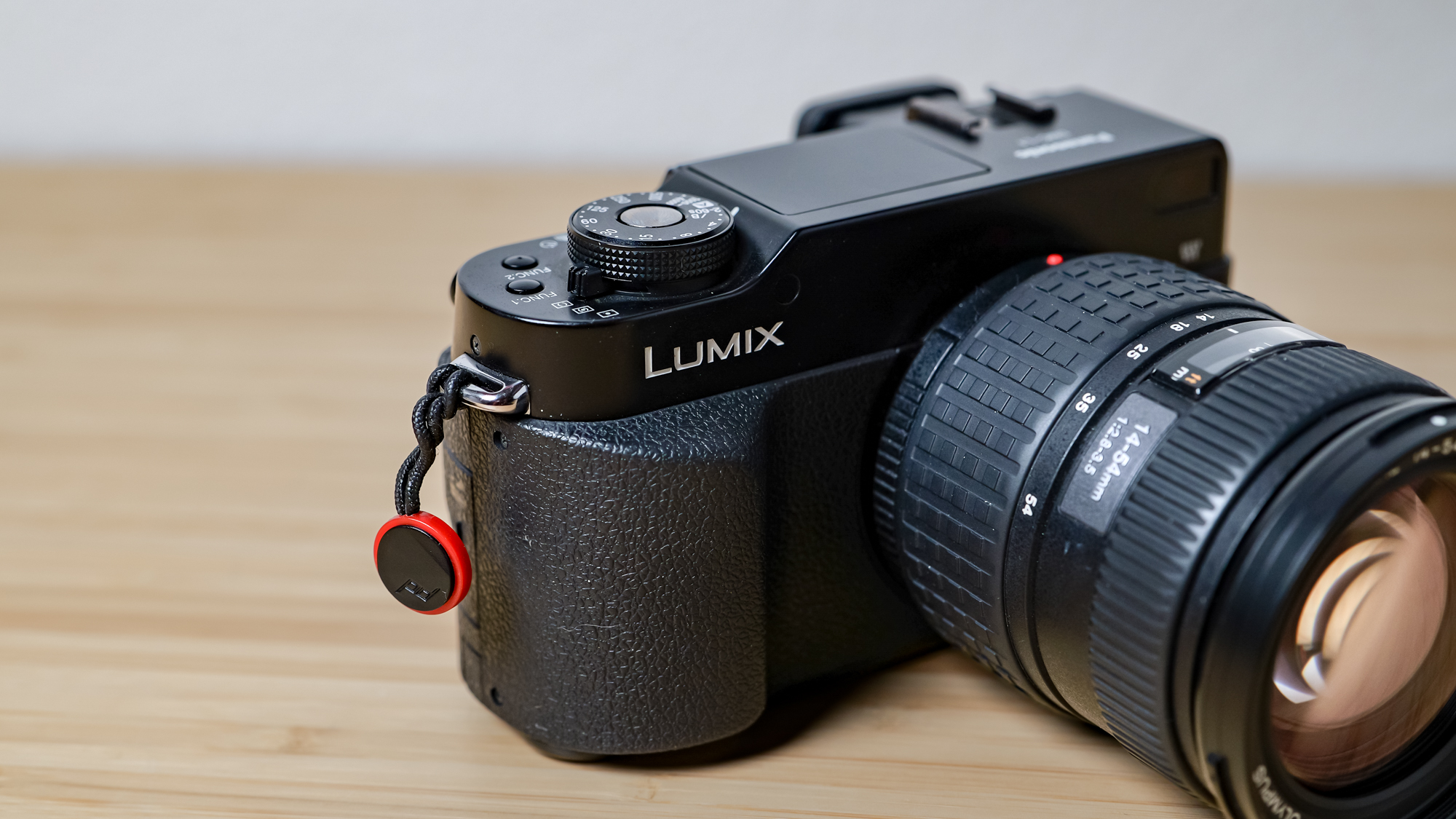 A photo of the Lumix L1 DSLR on a wooden surface