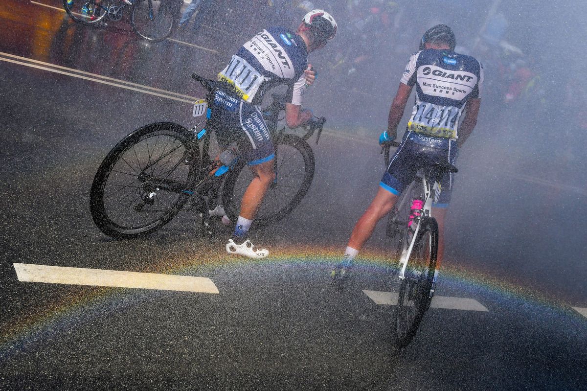 Chinese rider Zhiwen Chen with Giant teammate Liu Manduo post-stage