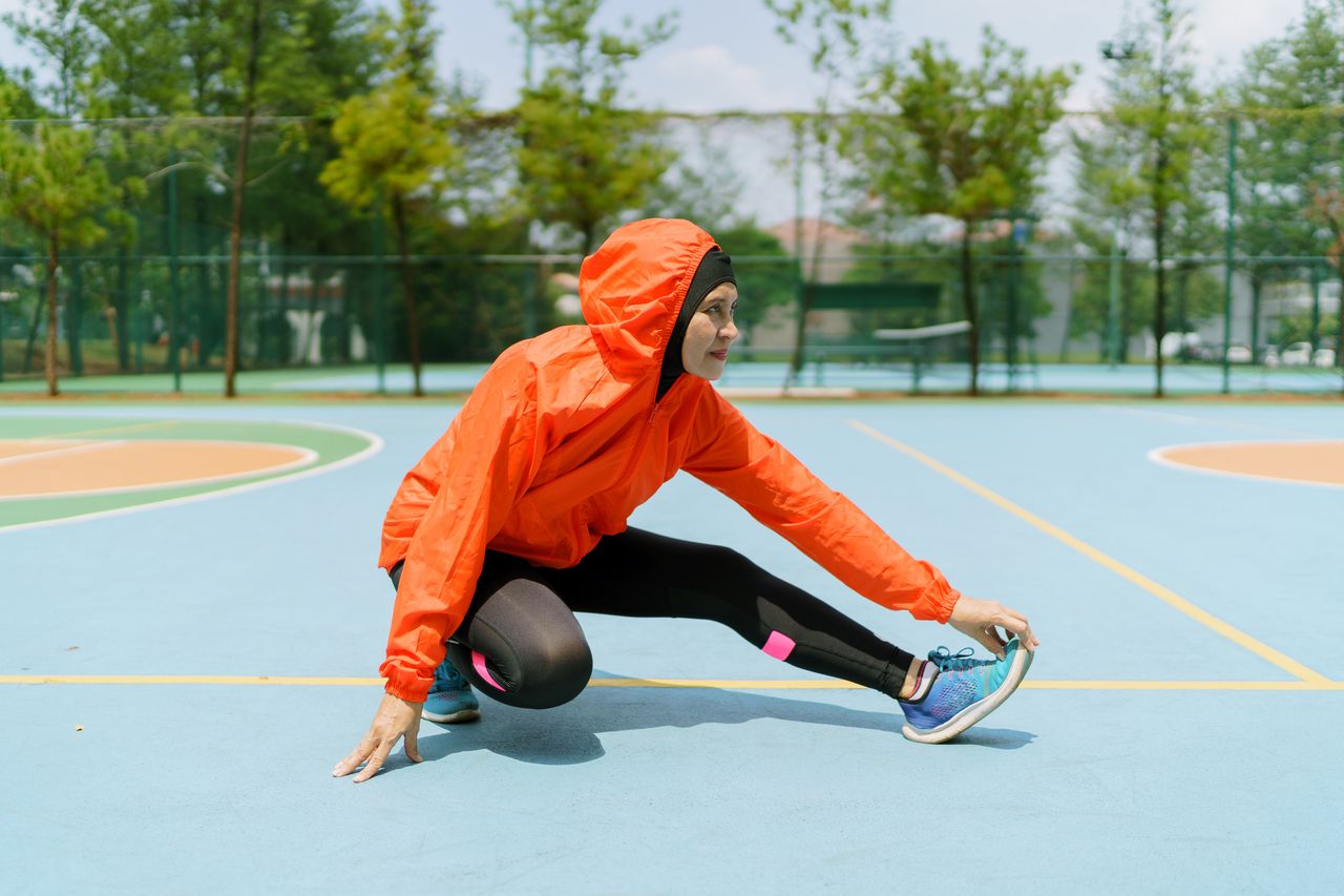 Workout hijabs: A woman stretches after a workout in a workout hijab