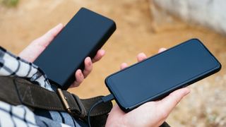 how to charge phones while camping: power bank and phone