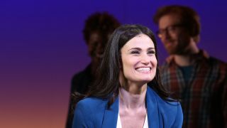 Idina Menzel smiling for the curtain call if If/Then