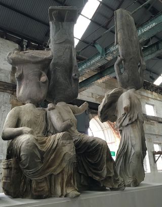 Greek statues with each connecting with another by the neck