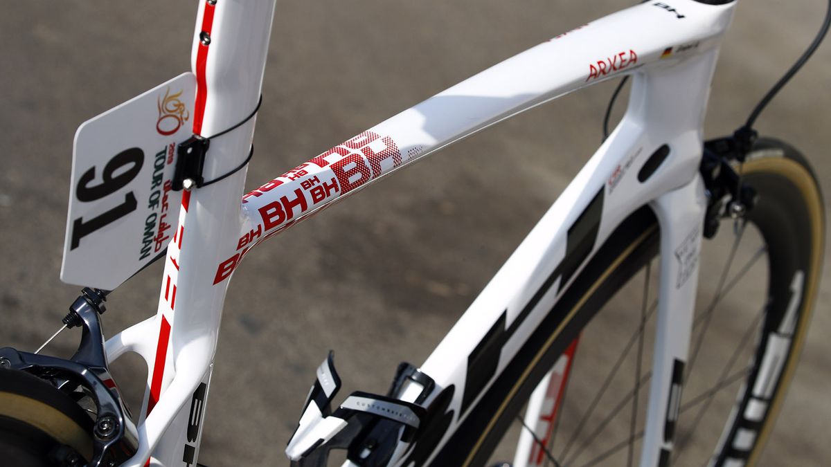 The seat tube and top tube intersection features a faded logo graphic from the Spanish brand