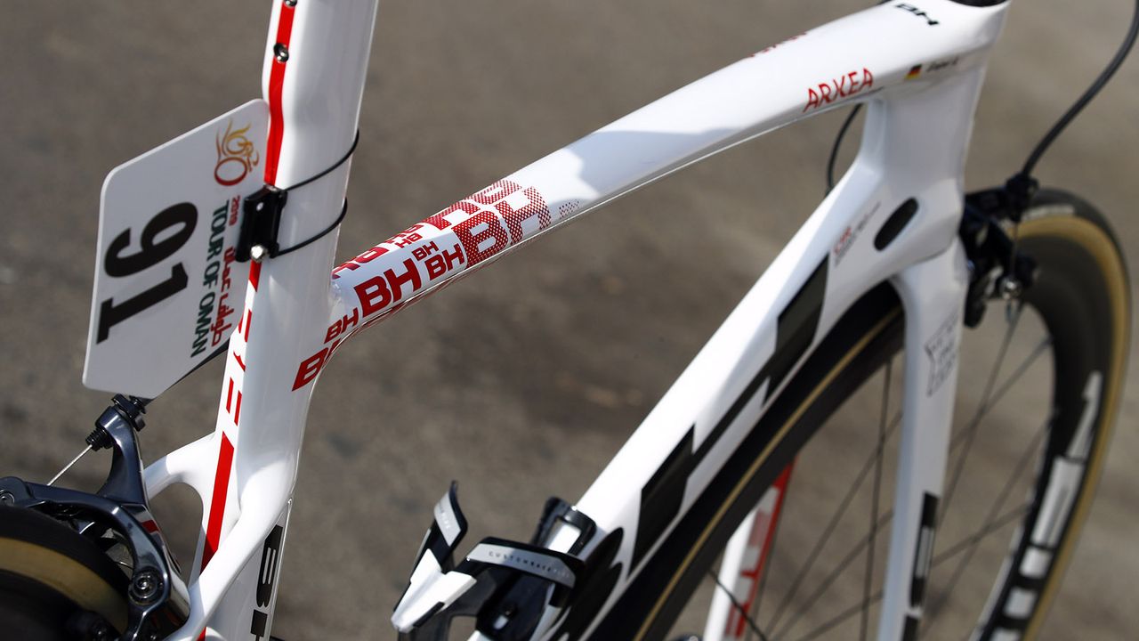 The seat tube and top tube intersection features a faded logo graphic from the Spanish brand