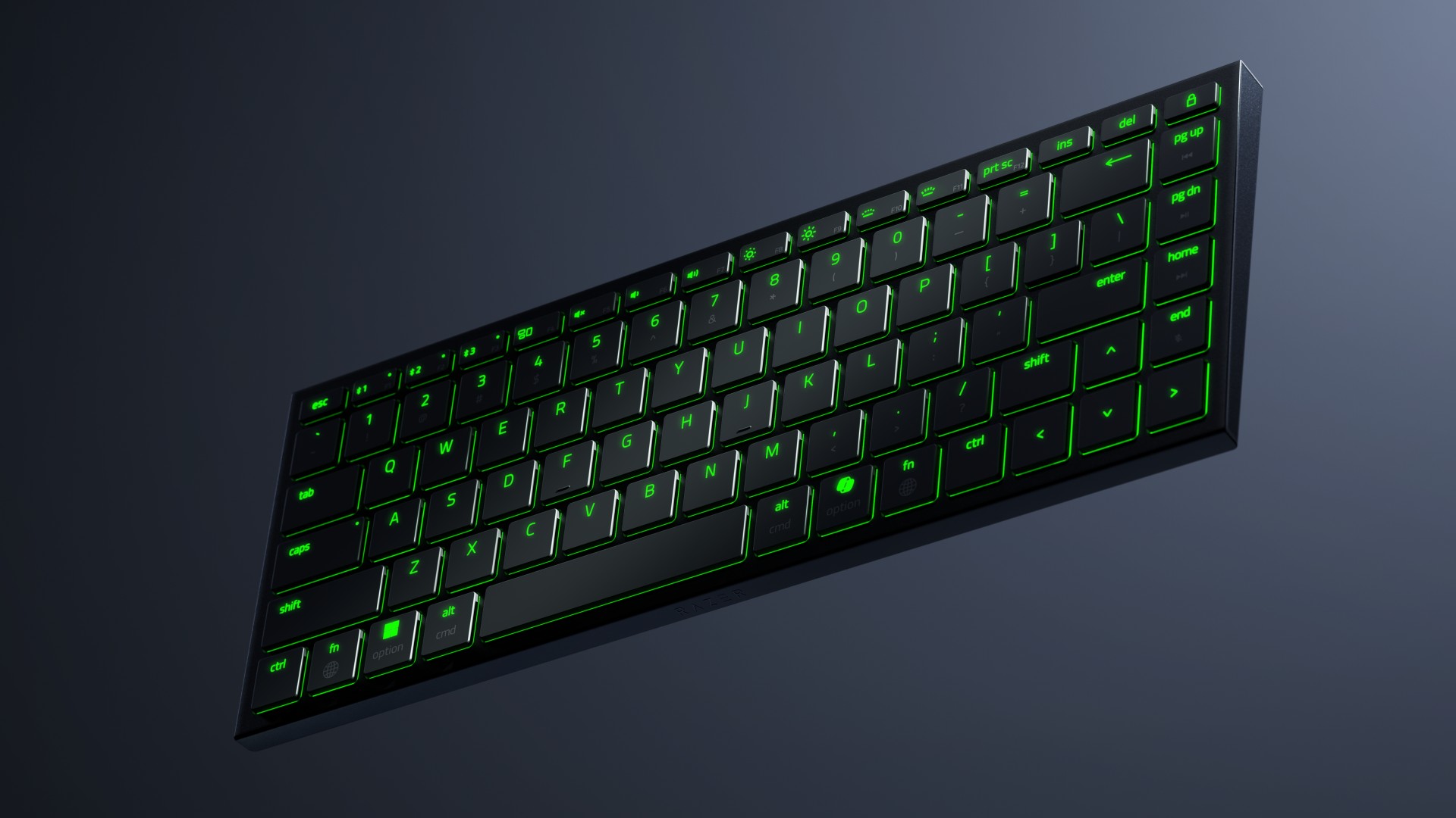 Razer Joro gaming keyboard with green RGB lighting on a gray background