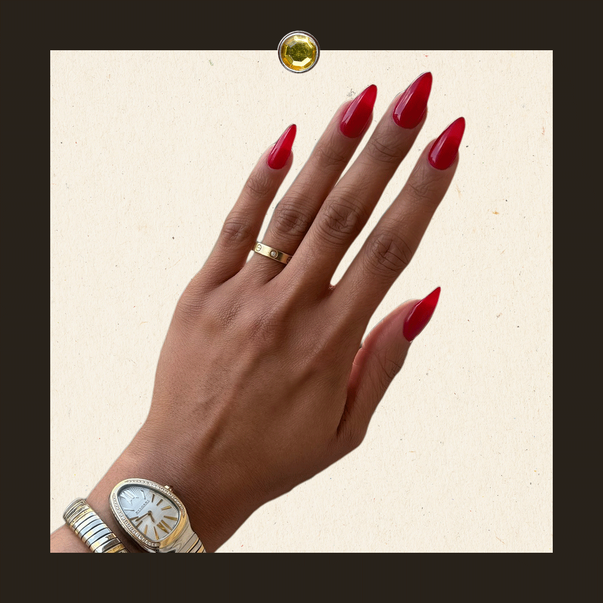 Woman with burgundy nails holding Chanel soap