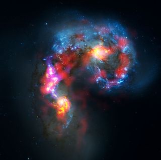 Humanity's most complex ground-based astronomy observatory, the Atacama Large Millimeter/submillimeter Array (ALMA), has officially opened for astronomers. The first released image, of the Antennae Galaxies, reveals a view of the Universe that cannot be s