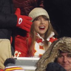 Taylor Swift in box seats at a Chiefs game wearing a cut up jacket