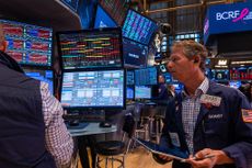 Traders work on the floor of the New York Stock Exchange (NYSE)
