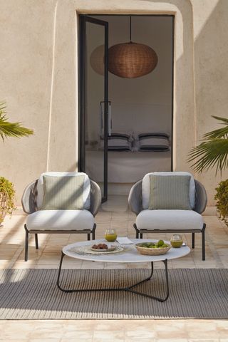 pair of armchairs on a sunny patio