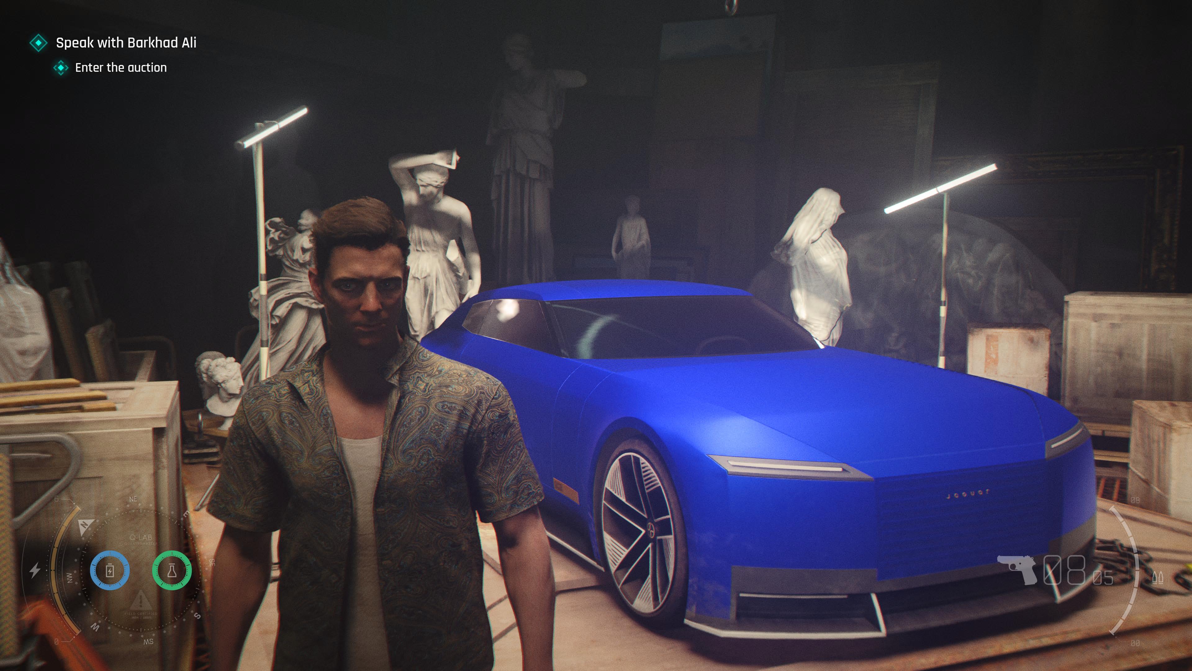 A young James Bond character in a floral shirt stands beside a vivid blue Jaguar EV in a dimly lit warehouse setting surrounded by classical statues, in a screenshot from the video game 007 First Light.
