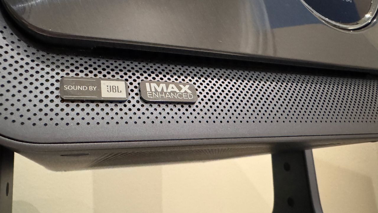 A close up of JBL and IMAX branding on the Hisense C2 Ultra projector.