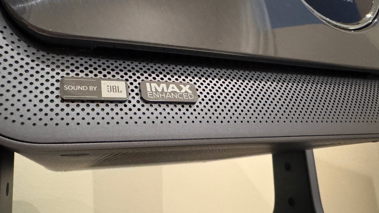 A close-up of JBL and IMAX branding on the Hisense C2 Ultra projector.