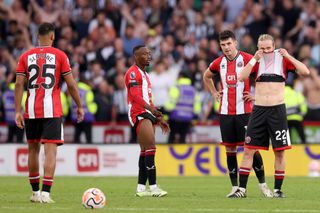 Tom Davies of Sheffield United reacts after Newcastle United scored their sides sixth goal during the Premier League match between Sheffield United and Newcastle United at Bramall Lane on September 24, 2023 in Sheffield, England. (Photo by George Wood/Getty Images)