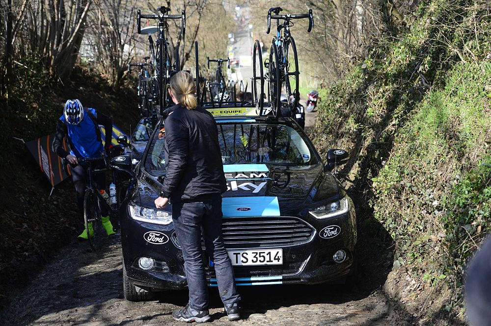 The Team Sky car tries to avoid reenacting the famous Jesper Skibby incident on the Koppenberg