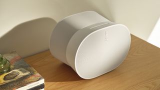 The Sonos Era 300 speaker sitting on a wooden side table