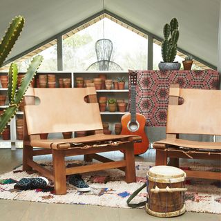 guitar with pots carpet on flooring and chair