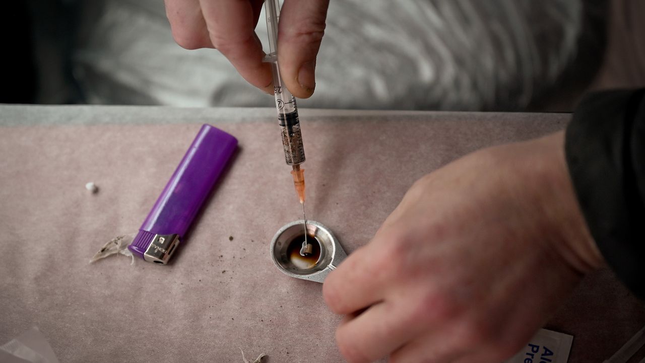 A syringe and cigarette lighter