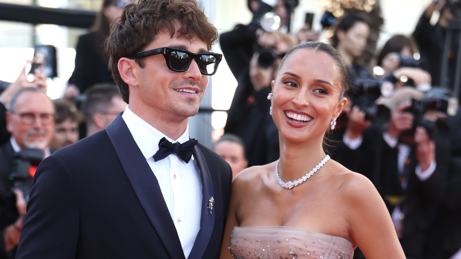 Charles and Alexandra Leclerc pose together at the 2026 Cannes Film Festival in red carpet looks