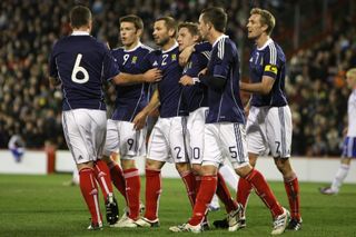 Kris Commons, centre, celebrates scoring against the Faroes in 2010