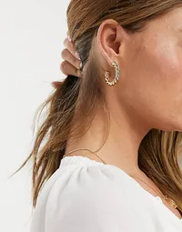 ASOS DESIGN 14k gold plated twist hoop earrings, £10 | ASOS