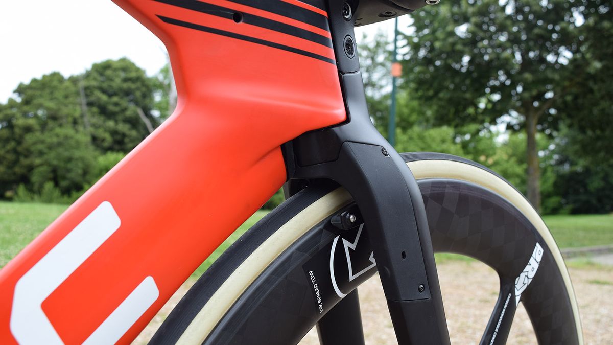 Many time trial bikes integrate their front brakes into the forks for improved aerodynamics