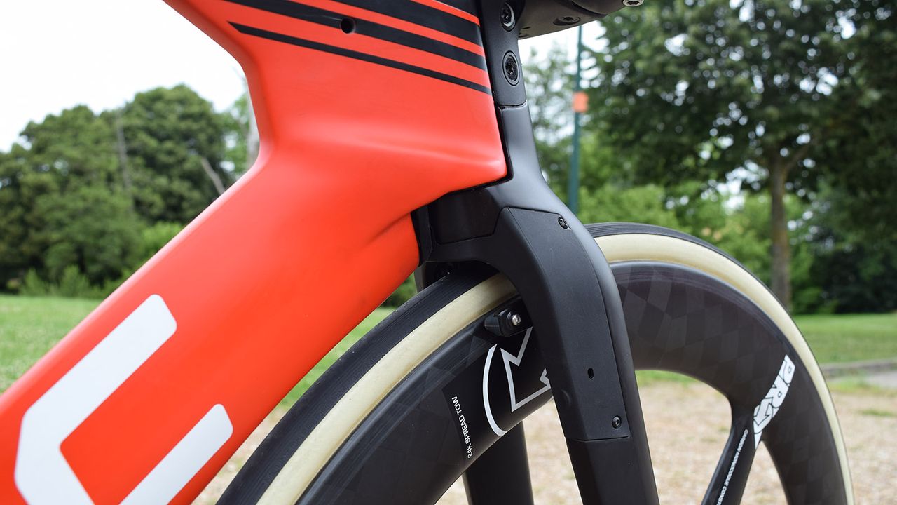 Many time trial bikes integrate their front brakes into the forks for improved aerodynamics