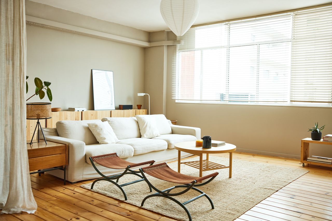 a white sofa in a beige living room