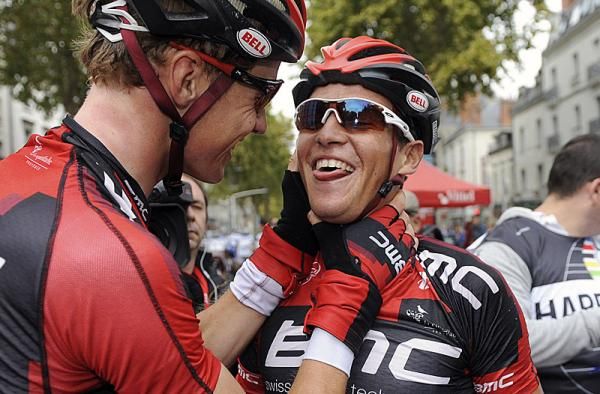 Paris-Tours winner Greg Van Avermaet is congratulated by a teammate.