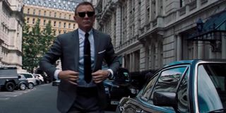 No Time To Die Daniel Craig walks in a sharp grey suit