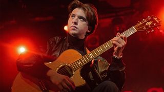 Polish percussive finger-style guitarist, composer, and producer Marcin Patrzalek poses during a photo session at the "La Maroquinerie" concert hall in Paris on March 17, 2025. 