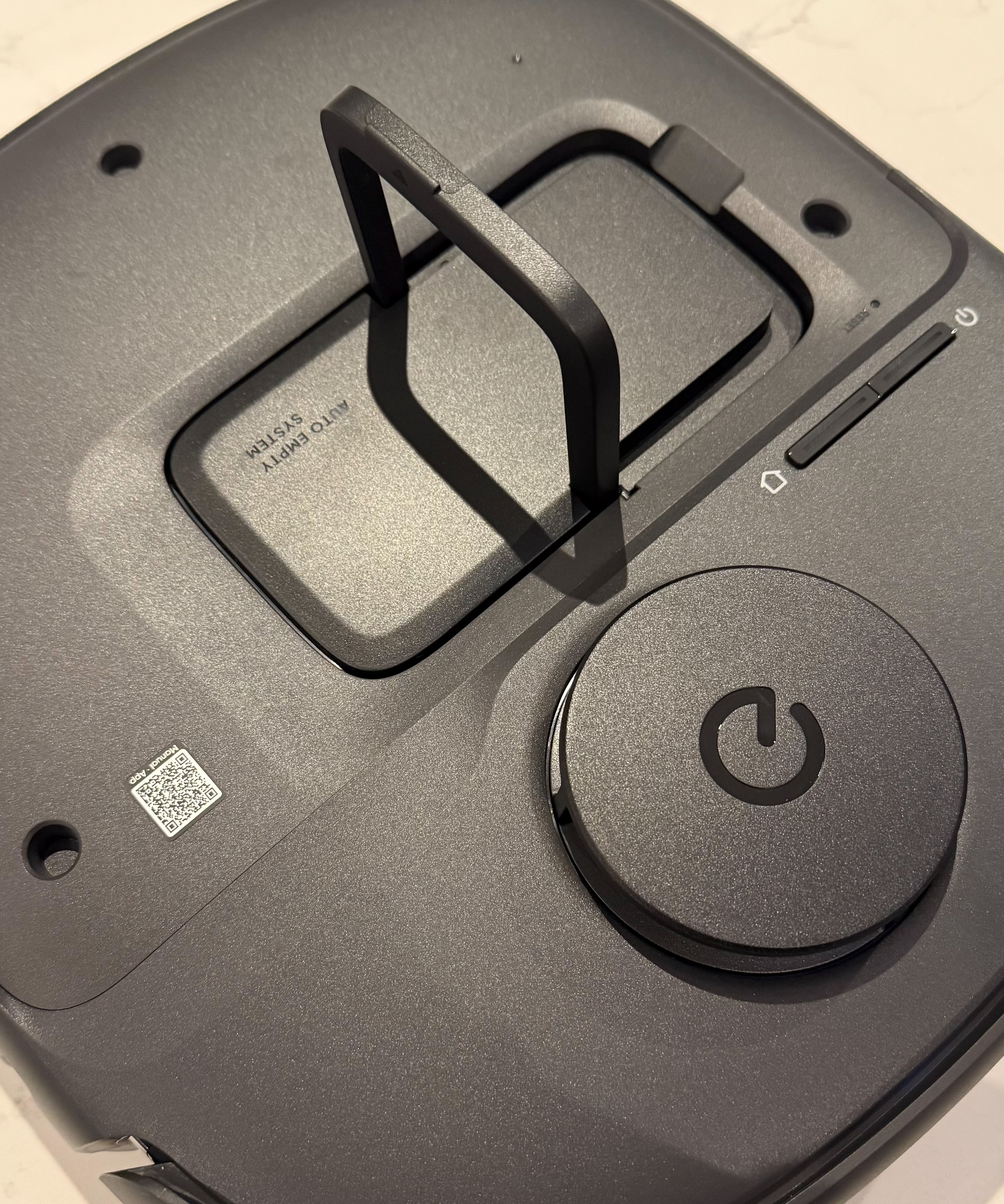 Close-up of eufy Omni C28 HEPA-style filter inside dust bin