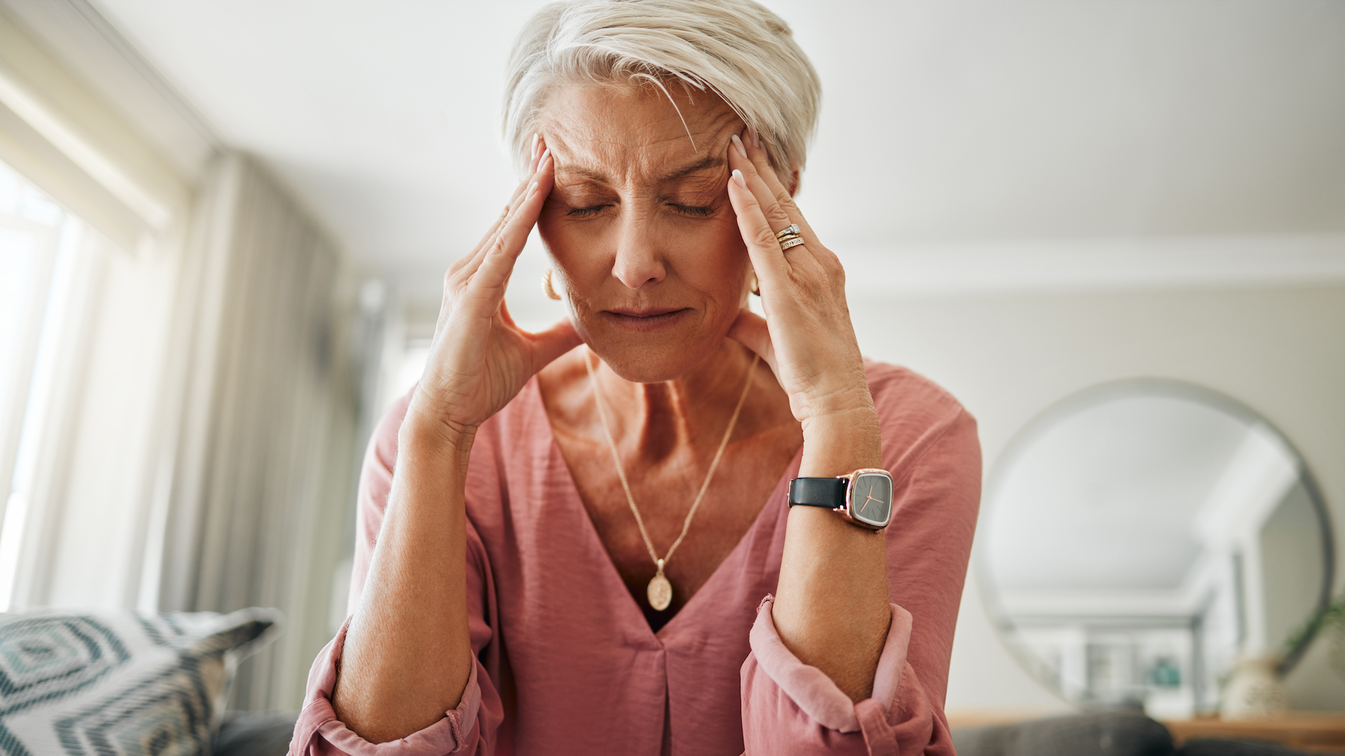 Woman struggling with a headache