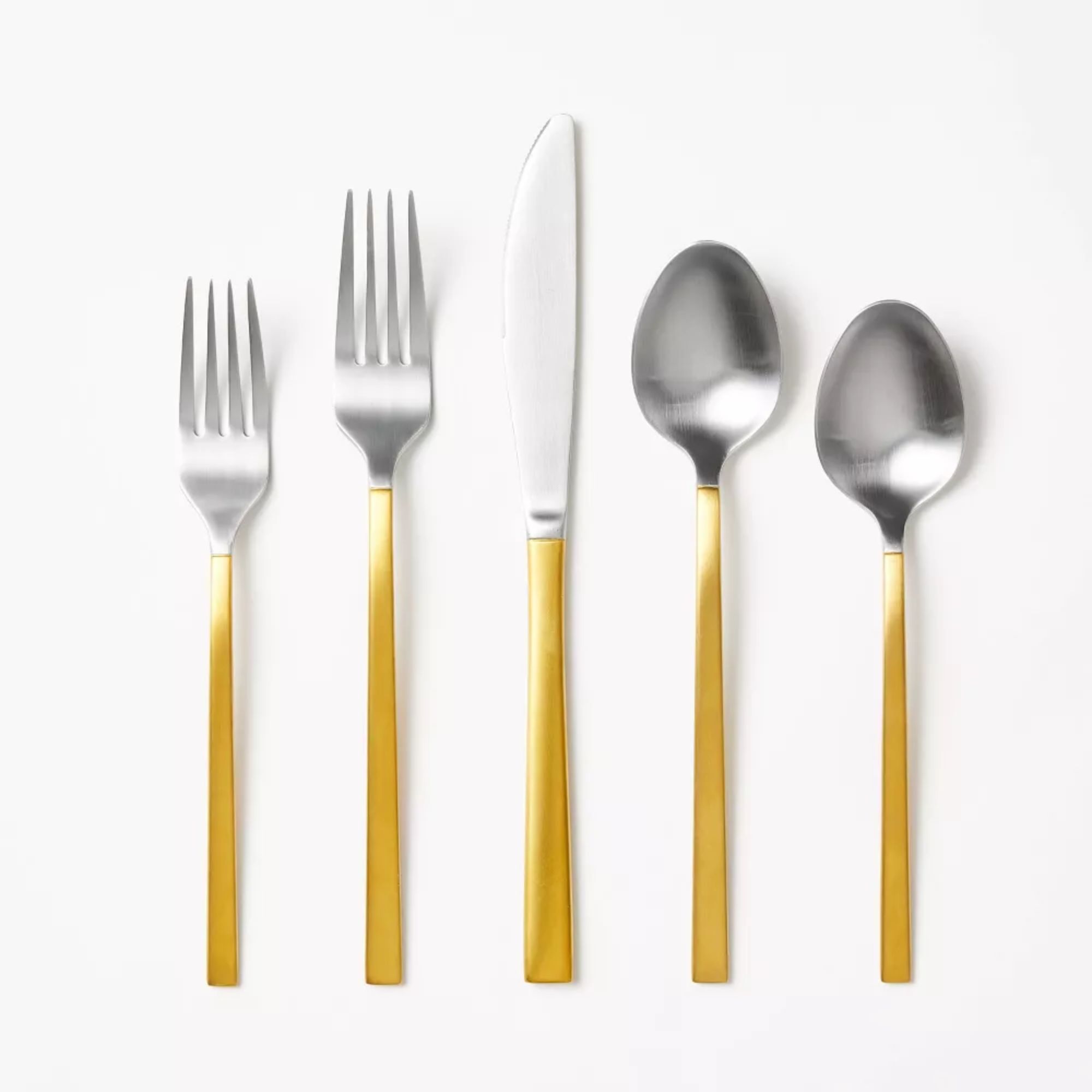 Two-tone gold and silver five-piece cutlery set