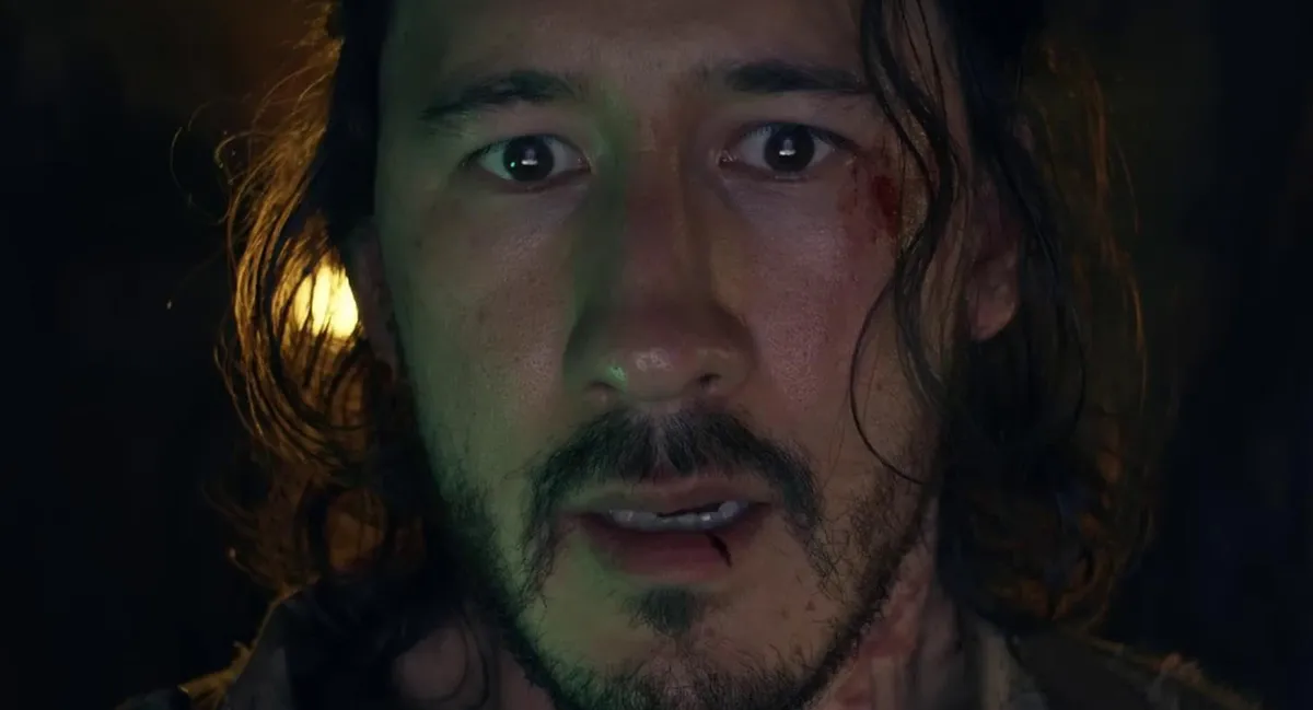 A close up of Markiplier in Iron Lung, looking scared