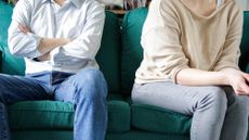 A couple sitting on a sofa