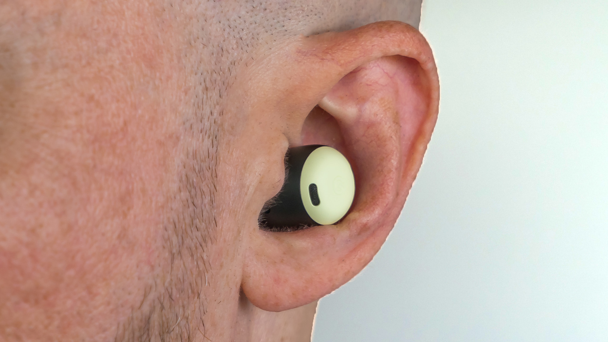 Close up of Google Pixel Buds Pro in ear.