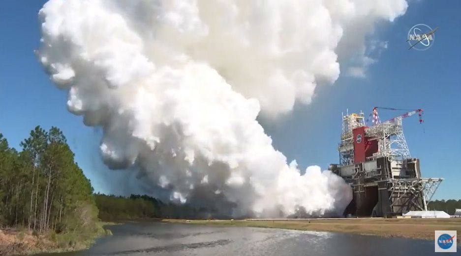 NASA's first Space Launch System megarocket test fires its four main RS-25 engines in a critical hot fire test at the Stennis Space Center near Bay St. Louis, Mississippi on March 18, 2021. The booster will launch NASA's Artemis 1 mission around the moon in late 2021.