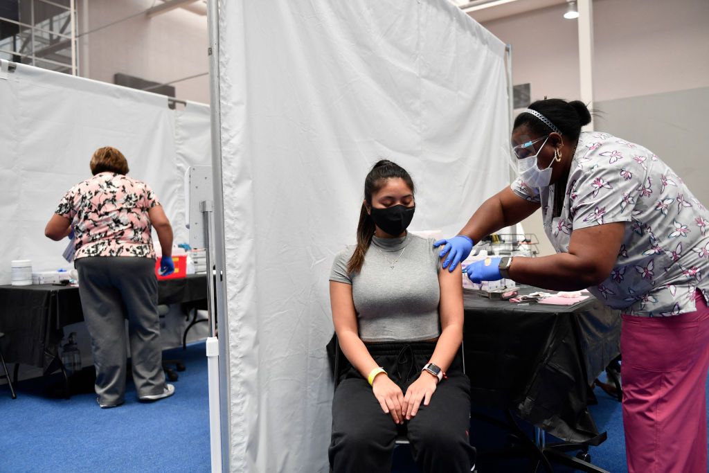 A nurse administers a dose of the Moderna Covid-19 vaccine at a clinic at a vaccination site at Loyola Marymount University on March 8, 2021.