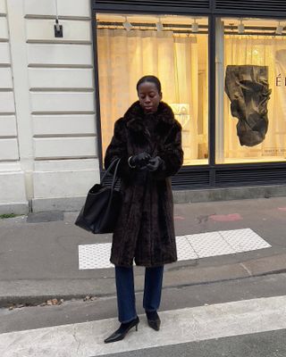 French woman wearing a fur coat