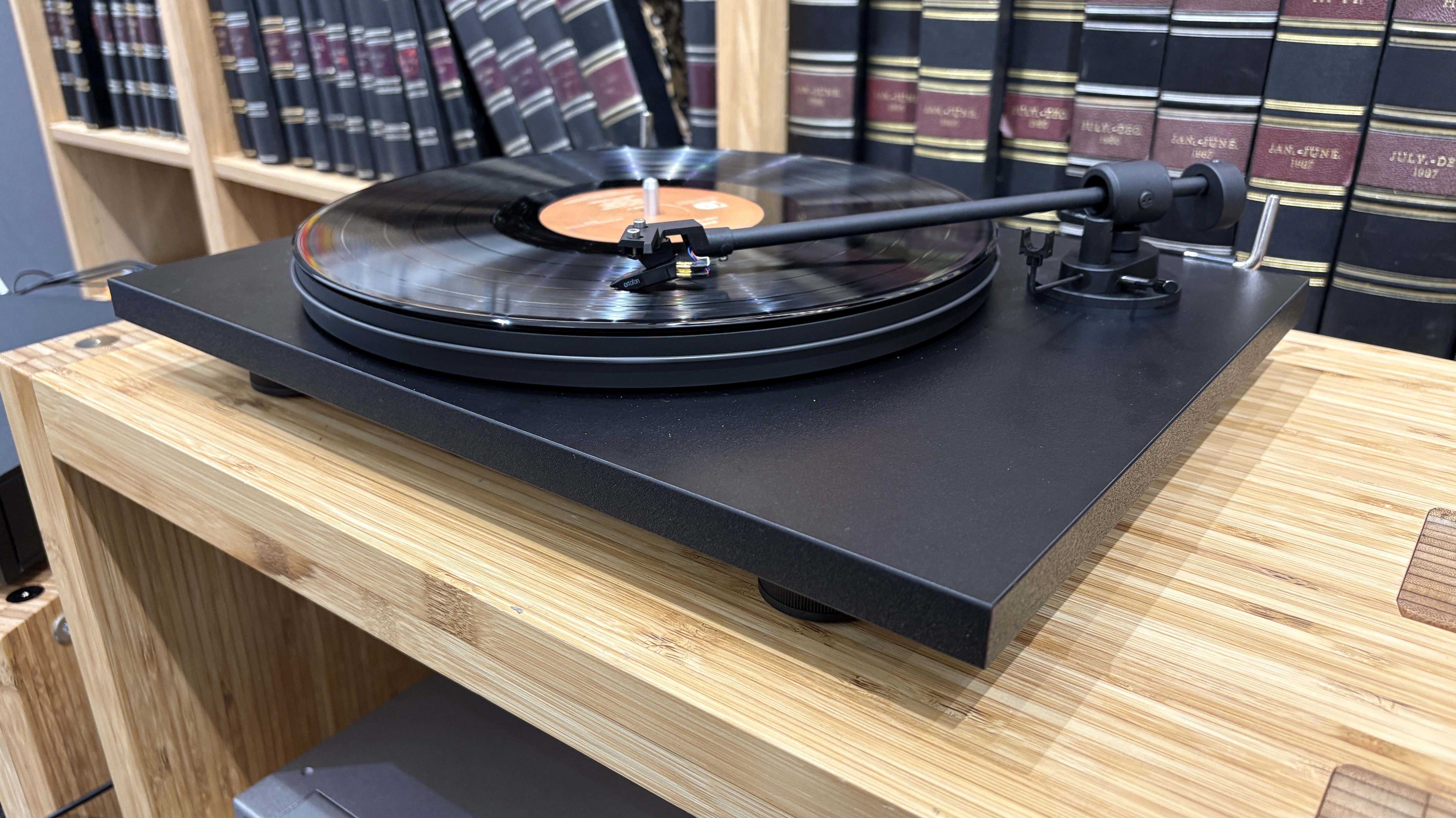 Pro-Ject Primary E turntable on wooden rack