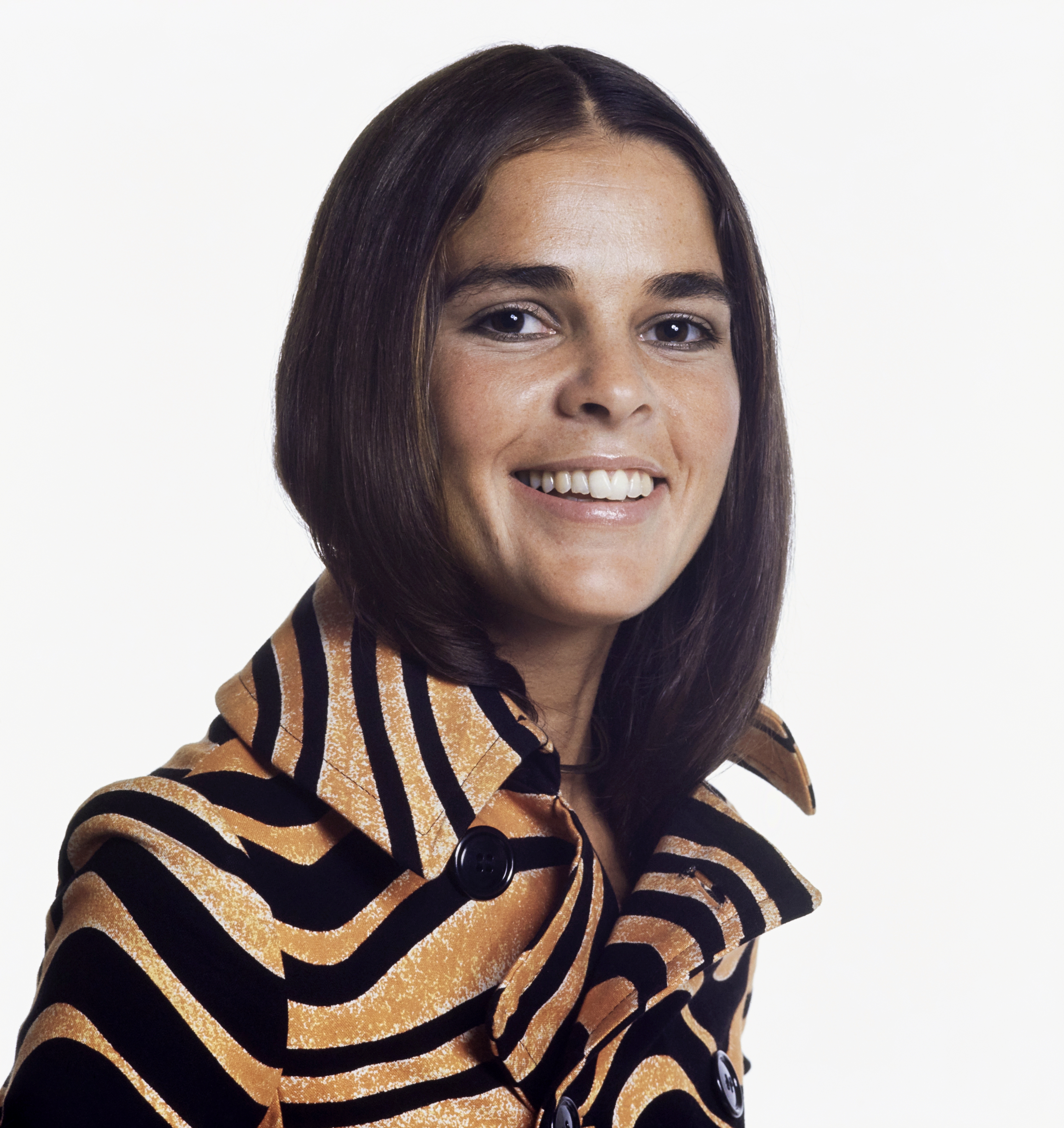 Ali MacGraw with bronzed skin and a smoky waterline in 1970