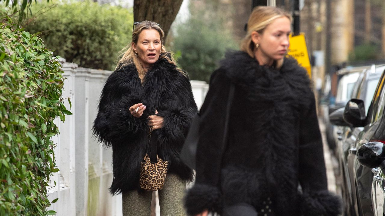 Kate Moss and Lila Moss wearing matching black coats