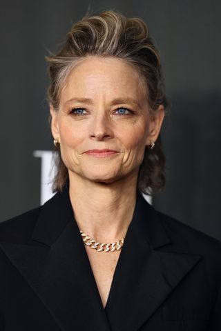 Jodie Foster is pictured with grey highlights whilst attending ELLE's Women in Hollywood Celebration at Nya Studios on December 05, 2023 in Los Angeles, California.