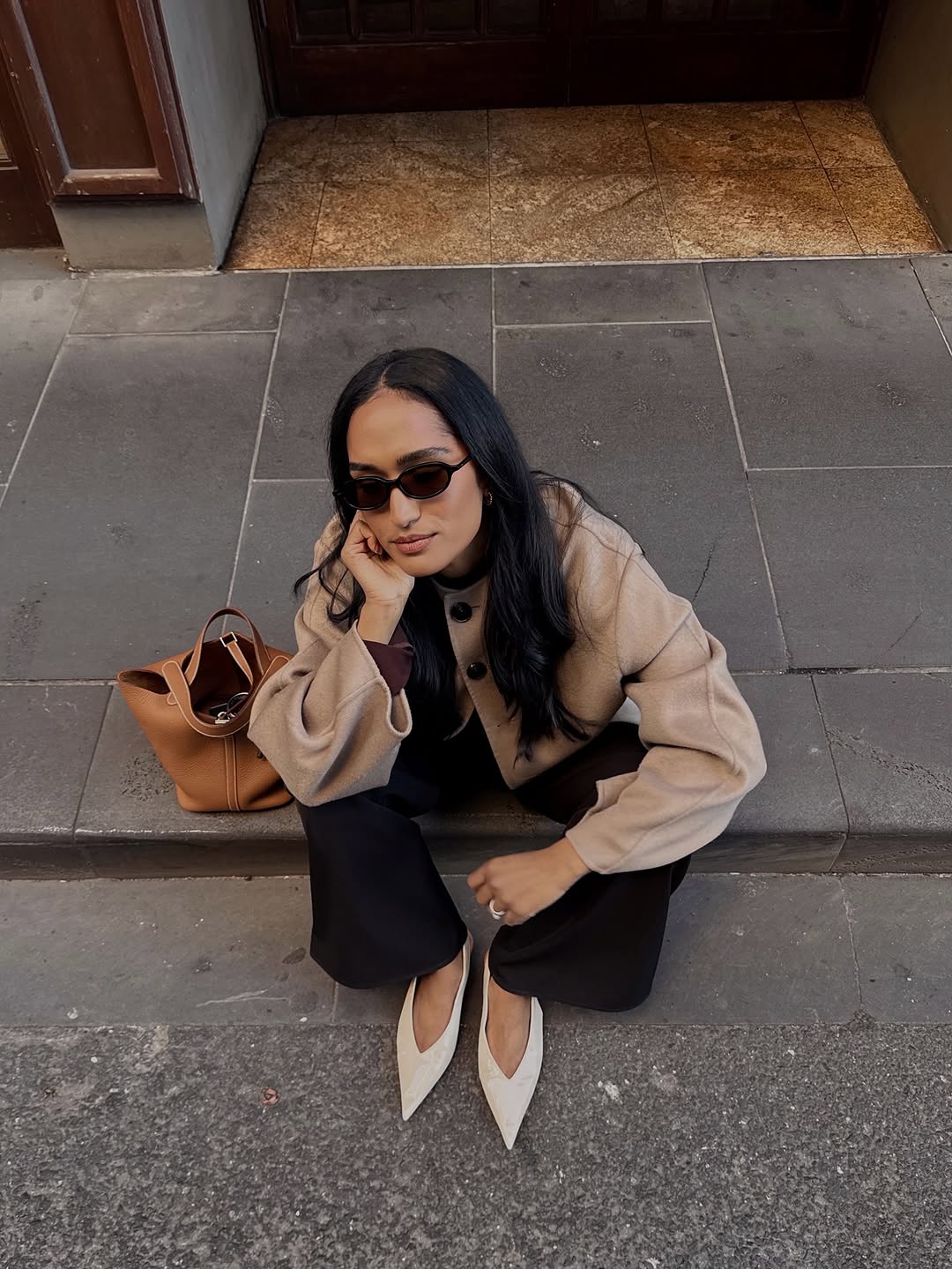 woman wearing neutral color pointed toe shoe trend 2025