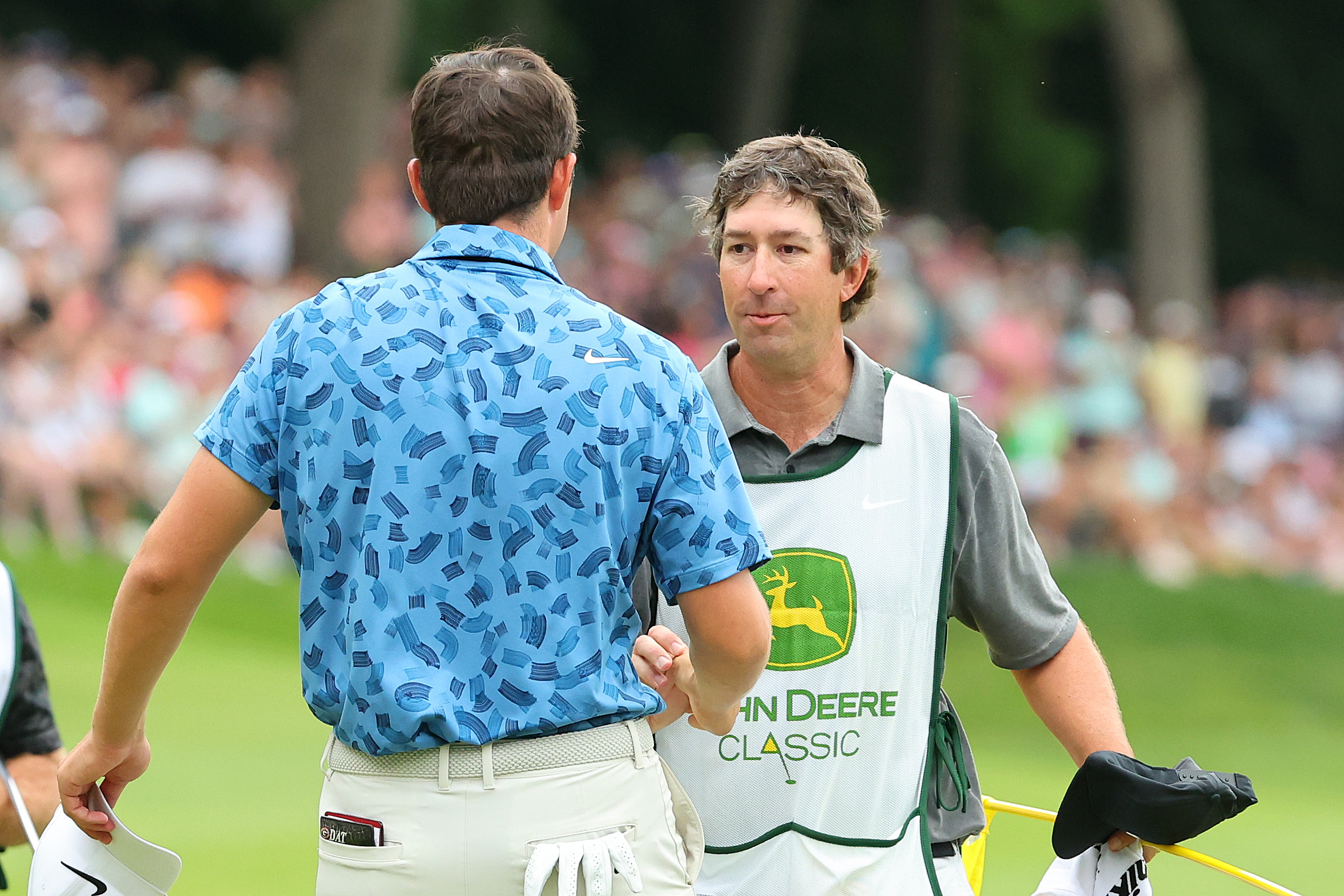 Joe Etter greets his boss, Davis Thompson after the 2025 John Deere Classic